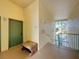 Building entryway with green door and bench, overlooking a lake at 8803 Dunes Ct # 306, Kissimmee, FL 34747