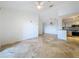 Open living room, kitchen, and dining area with tile floors at 8803 Dunes Ct # 306, Kissimmee, FL 34747