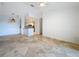 Open living room and kitchen with tile floors at 8803 Dunes Ct # 306, Kissimmee, FL 34747