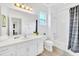Clean bathroom with white vanity, bathtub, and shower at 5192 Oakbourne Ave, Davenport, FL 33837