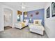 Two twin beds, yellow bedding, and a shared bath at 5192 Oakbourne Ave, Davenport, FL 33837