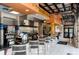 Community kitchen with bar seating and full-service appliances at 5192 Oakbourne Ave, Davenport, FL 33837