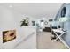 Spacious loft area with a desk and seating area at 5192 Oakbourne Ave, Davenport, FL 33837