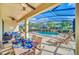 Relaxing pool area with patio furniture and screened enclosure at 5192 Oakbourne Ave, Davenport, FL 33837