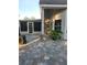 Backyard with brick patio, screened in porch, and views of the yard at 12212 Holly Jane Ct, Orlando, FL 32824