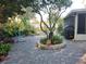 Paver patio boasts a central tree planter with lush greenery, creating a serene outdoor living space at 12212 Holly Jane Ct, Orlando, FL 32824