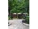 Backyard with pavers, lush trees, and relaxing hammock at 12212 Holly Jane Ct, Orlando, FL 32824