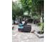 Backyard patio featuring an outdoor seating area, a garden and many large trees at 12212 Holly Jane Ct, Orlando, FL 32824