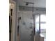Clean bathroom featuring a glass-enclosed shower with modern fixtures and a large soaking tub at 12212 Holly Jane Ct, Orlando, FL 32824