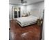 Main bedroom with wood-look floors and sliding glass doors at 12212 Holly Jane Ct, Orlando, FL 32824