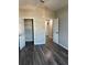 Neutral bedroom features gray walls, luxury vinyl plank flooring and a spacious closet for easy organization at 12212 Holly Jane Ct, Orlando, FL 32824