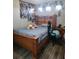 Bedroom with laminate wood flooring and wooden furniture at 12212 Holly Jane Ct, Orlando, FL 32824