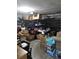 Garage is cluttered with boxes and storage racks at 12212 Holly Jane Ct, Orlando, FL 32824
