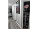 Hallway with wire shelving and artwork at 12212 Holly Jane Ct, Orlando, FL 32824