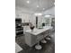 Modern kitchen with white cabinets, large island, and stainless steel appliances at 12212 Holly Jane Ct, Orlando, FL 32824