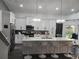 Spacious kitchen featuring a large island with bar seating, modern appliances, and ample cabinet space at 12212 Holly Jane Ct, Orlando, FL 32824