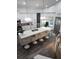 Modern kitchen with white cabinets, large island, and stainless steel appliances at 12212 Holly Jane Ct, Orlando, FL 32824