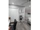 Spacious loft area with wood-look floors and a modern aesthetic at 12212 Holly Jane Ct, Orlando, FL 32824