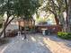Relaxing patio with pergola, seating area, and lush greenery at 12212 Holly Jane Ct, Orlando, FL 32824