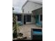 Paver patio featuring outdoor seating that provides a relaxing space, and a screened in back porch at 12212 Holly Jane Ct, Orlando, FL 32824