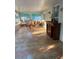 Bright sunroom featuring tile floors, table with chairs and bar at 12212 Holly Jane Ct, Orlando, FL 32824