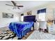 Comfortable bedroom with a plush bed, desk, and wood floors at 361 Spring Leap Cir, Winter Garden, FL 34787