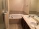 Bathroom with double vanity, garden tub, and separate shower at 10583 Regent Square Dr # 1206, Orlando, FL 32825