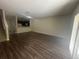Spacious living room with modern flooring and an open kitchen at 10583 Regent Square Dr # 1206, Orlando, FL 32825