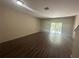 Bright living room with a sliding glass door and modern floors at 10583 Regent Square Dr # 1206, Orlando, FL 32825