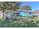 Spacious backyard with patio furniture and large tree at 1188 Anne Elisa Cir, St Cloud, FL 34772
