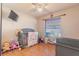bedroom with crib, toys, and ample natural light at 1188 Anne Elisa Cir, St Cloud, FL 34772