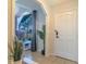 Bright and airy entryway with a view into the living room at 1188 Anne Elisa Cir, St Cloud, FL 34772