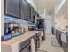 Modern kitchen with dark cabinetry, stainless steel appliances at 1188 Anne Elisa Cir, St Cloud, FL 34772