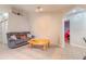 Cozy living room featuring a gray sofa and coffee table at 1188 Anne Elisa Cir, St Cloud, FL 34772