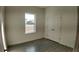 A bright bedroom features double door closet and a bright window at 1321 Congo Dr, Kissimmee, FL 34759
