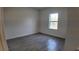 Bedroom with wood-look tile flooring and natural light from a window at 1321 Congo Dr, Kissimmee, FL 34759