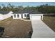 Charming single-story home with a well-manicured lawn and an attached two-car garage at 1321 Congo Dr, Kissimmee, FL 34759
