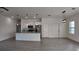 Contemporary kitchen featuring a granite island, stainless steel appliances, and stylish pendant lighting at 1321 Congo Dr, Kissimmee, FL 34759