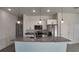 Modern kitchen with granite countertops, stainless steel appliances, and white shaker-style cabinets at 1321 Congo Dr, Kissimmee, FL 34759