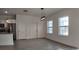 Bright living area with tile floors, white walls, and access to a modern kitchen with stainless appliances at 1321 Congo Dr, Kissimmee, FL 34759