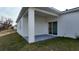 Covered patio with sliding glass doors and lawn at 1321 Congo Dr, Kissimmee, FL 34759