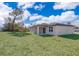 Spacious backyard with grassy area and covered patio at 15321 Sw 43Rd Avenue Rd, Ocala, FL 34473