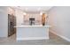 Modern kitchen featuring a large island, stainless steel appliances, and ample cabinet space at 15321 Sw 43Rd Avenue Rd, Ocala, FL 34473
