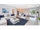 Open concept living space with contemporary furniture and tile floors at 15321 Sw 43Rd Avenue Rd, Ocala, FL 34473