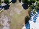 Aerial view of a neighborhood park with soccer goals and a walking path at 1610 Lima Ave, Kissimmee, FL 34747