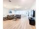 Finished basement with L-shaped sectional sofa and TV at 1610 Lima Ave, Kissimmee, FL 34747