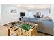 Basement recreation area with foosball table and large TV at 1610 Lima Ave, Kissimmee, FL 34747