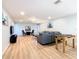Finished basement with L-shaped sofa, foosball table, and TV at 1610 Lima Ave, Kissimmee, FL 34747