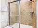 Clean bathroom with shower/tub combo and tile surround at 1610 Lima Ave, Kissimmee, FL 34747