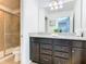 Double vanity bathroom with granite countertop at 1610 Lima Ave, Kissimmee, FL 34747